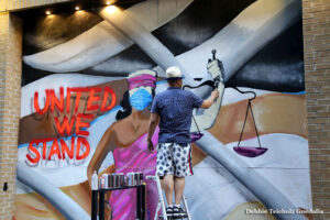 Man Spray Painting Mural, United We stand, 2020, Soho , New York City